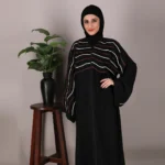 "Kainat Black Abaya with dori and zipped front by Alsanaya, matching hijab included"