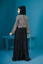 A classic black abaya with intricate embroidery showcasing elegance and modesty.