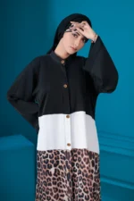 “Eshal Abaya by Al Sanaya with bold color block and cheetah print”