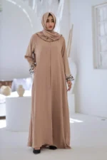 “Alisha Beige Abaya by Al Sanaya with organza embroidery on sleeves”